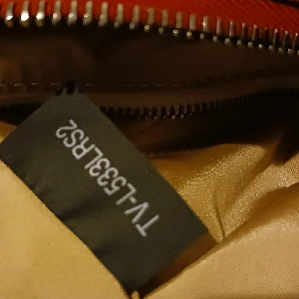 Valentino Garavani pouch.